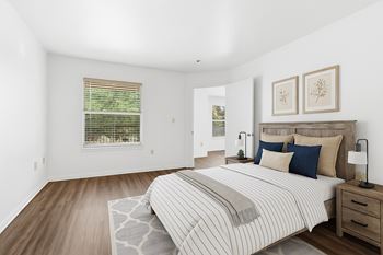 Bed and a window with blinds